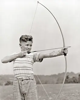 Preteen: Preteen Boy Aiming Bow and Arrow