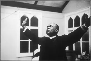 Caribbeans: Priest at a church service