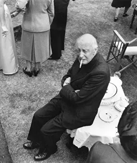 Wetherby: Priest resting at wedding reception, Wetherby, Yorkshire
