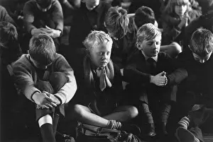 Primary school children saying prayers during assembly