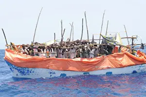 Rickety: Primitive boat crowded with suspected pirates ?