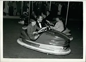 Dodgem: Prince Charles in dodgem car at fun fair, Olympia, London