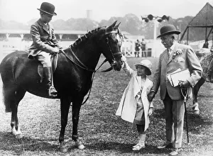 Stroking: Princess Elizabeth stroking a pony