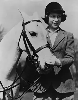 Princess Elizabeth with a white pony on her thirteenth