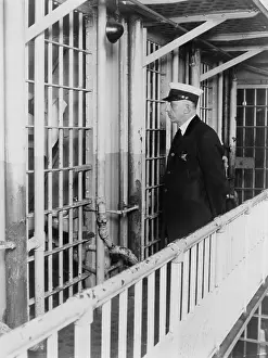 Confessed: A prison guard at the Cook County jail standing ?