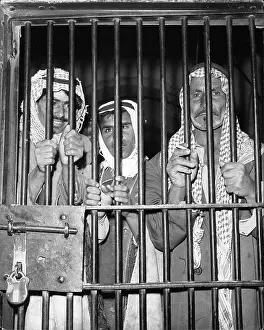 Overthrown: Three prisoners behind bars in Iraq