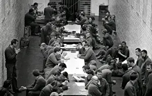 Oosterbroek: Prisoners sitting at long tables in courtyard