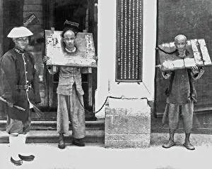 Prisoners wearing the Cangue, China