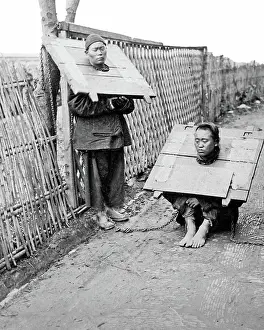 Two prisoners wearing the Cangue, China