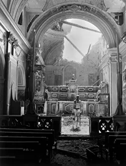 Undamaged: Private Paul Oglesby, stands before the altar