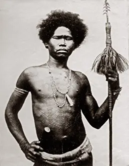 Scarring: Probably the Philippines - man ritual scarring and spear