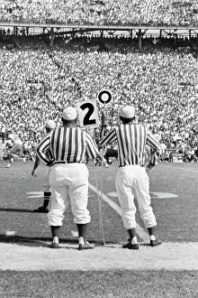 Referees: Professional Football Game from Sidelines Referees Crowded