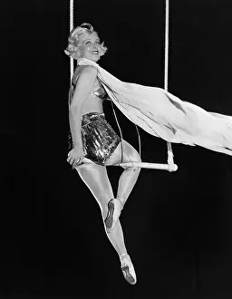 Hazardous: Profile of a female circus performer performing