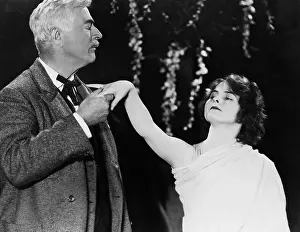 Affections: Profile of a man kissing a woman's hand