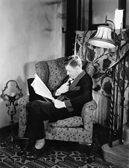Pencils: Profile of a man sitting in an armchair and reading a book