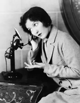 Lamenting: Profile of a woman talking on the telephone