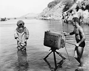 Seascapes: Profile of a young man holding a camera with a scuba