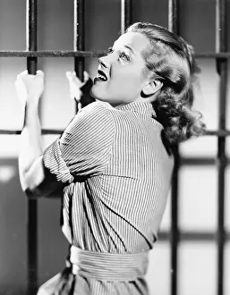 Scream: Profile of a young woman in a prison cell