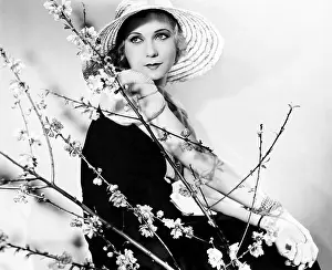 Anticipating: Profile of a young woman wearing a hat