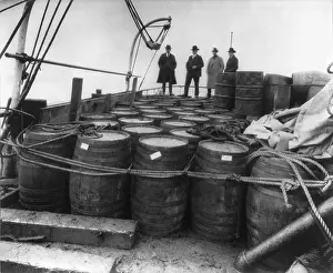 Lcgr2003: Prohibition agents examining barrels on the
