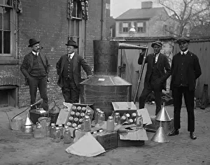 4 People: Prohibition agents stand with a still and mason