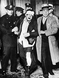 Smuggling: Prohibition: A bootlegger is being arrested, New York, 1932