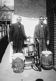 Whiskey: Prohibition era photograph of two men posing with