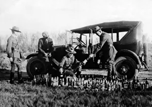 Prohibition: Prohibition: Policemen arrest a bootlegger