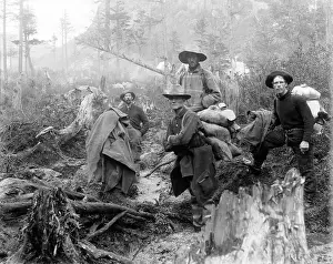 Panning: Four prospectors posed on trail in Alaska ?
