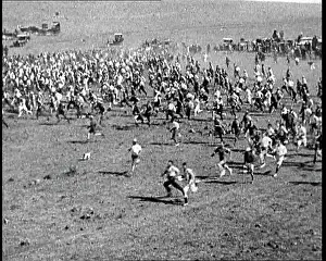 Prospectors: Prospectors Running Across A Field In Australia