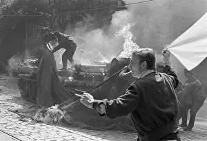 Crewman: Protest - protesters - anger - national flag - tank - fire
