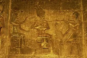 Deities: Ptolemaic temple of Hathor and Maat. Pharaoh making an offer