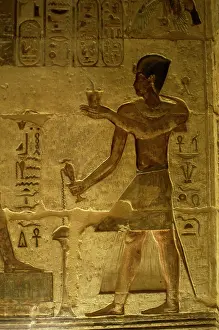 Offerings: Ptolemaic temple of Hathor and Maat. Pharaoh making offering