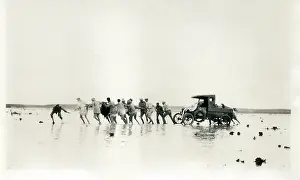Sepia Images: Pulling a car out of the mud, Middle East
