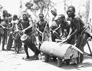 Pygmies: Pygmes of the Balele tribe. 3 Cylindrical drums and