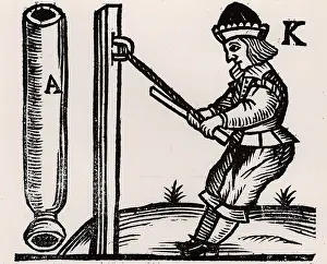 Tightly: A Pyrotechnist or Firework-maker making a rocket