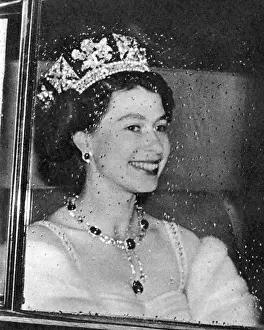 41st: The Queen drives through rain to the House of Lords