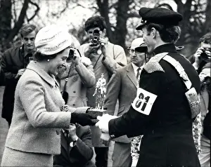Successive: Queen Elizabeth II awarding trophy to Mark Phillips