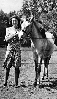 The Queen as a girl with a pony