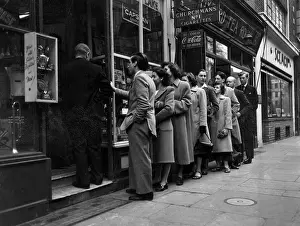 Tobacconists: Queue for a tobacconists, London 1940s