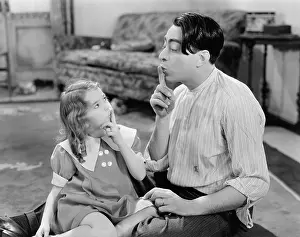 Imitating: Quiet please, father and dughter making shh sounds