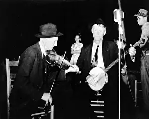 Bluegrass: R. J. Boyd, playing fiddle, and Millard ?