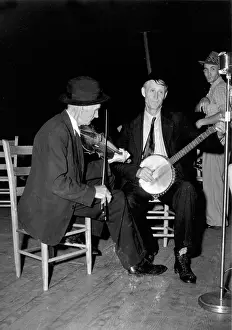 Bluegrass: R. J. Boyd, playing fiddle, and Millard ?