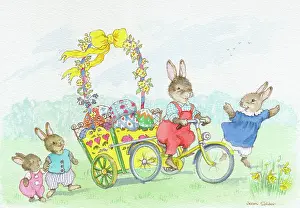 Rabbit on tricycle with trailer of Easter Eggs