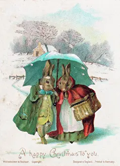 Two rabbits in the snow on a Christmas card