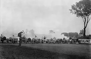 Racecars: Race cars lined up at the start of an auto
