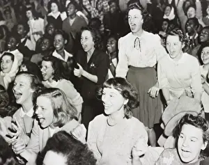 Lcgr2003: Racially integrated audience listens as singer