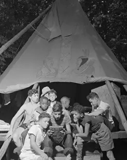 Lcgr1409: Racially integrated group of boys sharing a comic