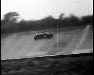 Brooklands: Racing Car Driving Down a Track at Brooklands