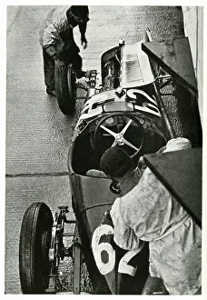 Treated: Racing car on a wet track with cut tyres